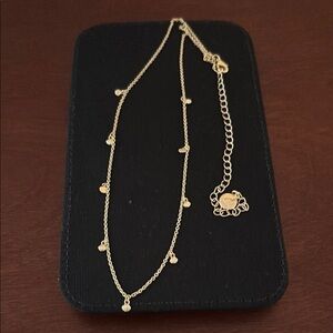 Bryan Anthony’s Elegant 14k Gold Finish Necklace with Charm Accents